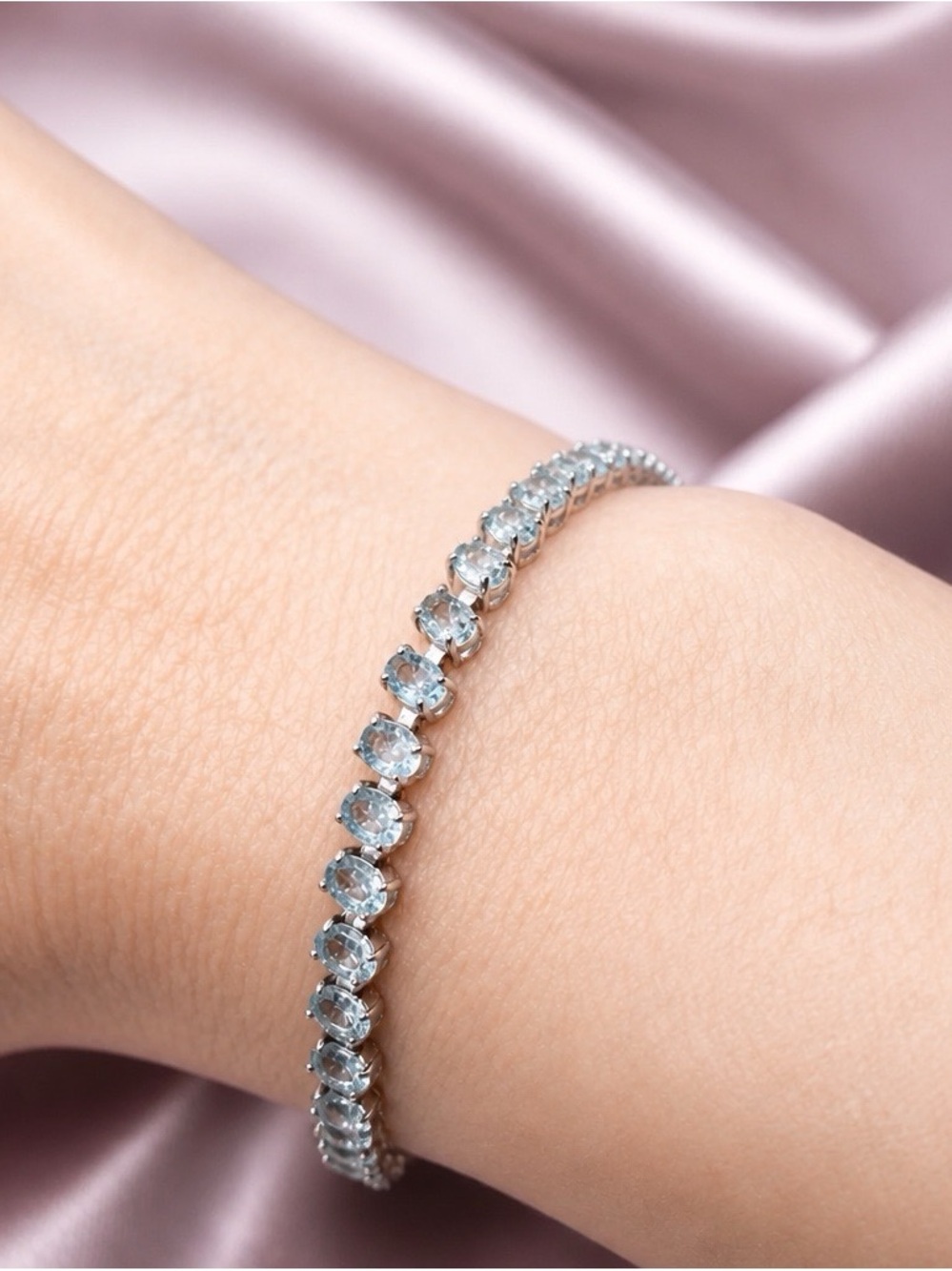 Aquamarine tennis bracelet set in rhodium over 925 Sterling Silver. Brand new